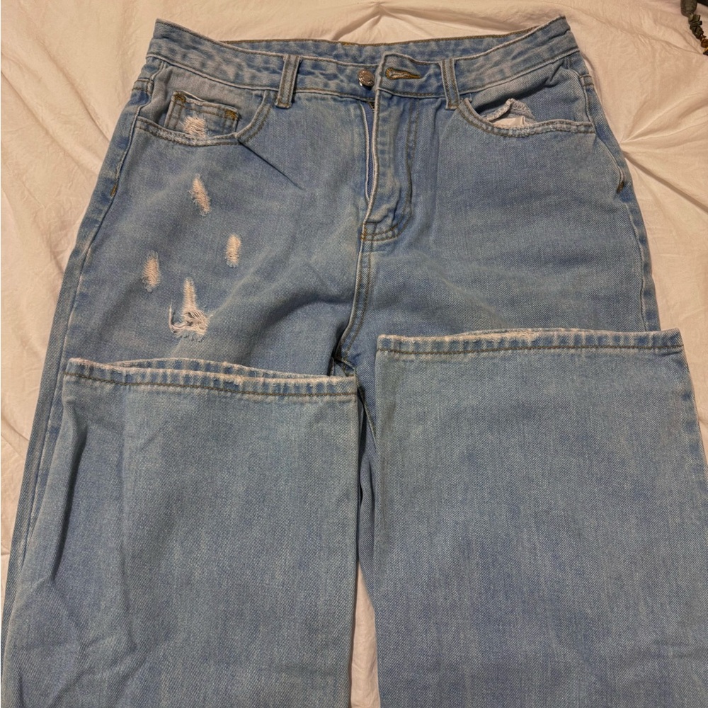 SHEIN Light-blue ripped jeans.